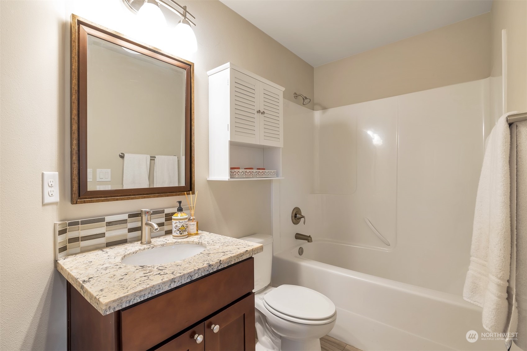 13508 6th Avenue Southwest Burien, WA 98146 - Photo 29 of 39 a bathroom with a granite countertop sink toilet and shower