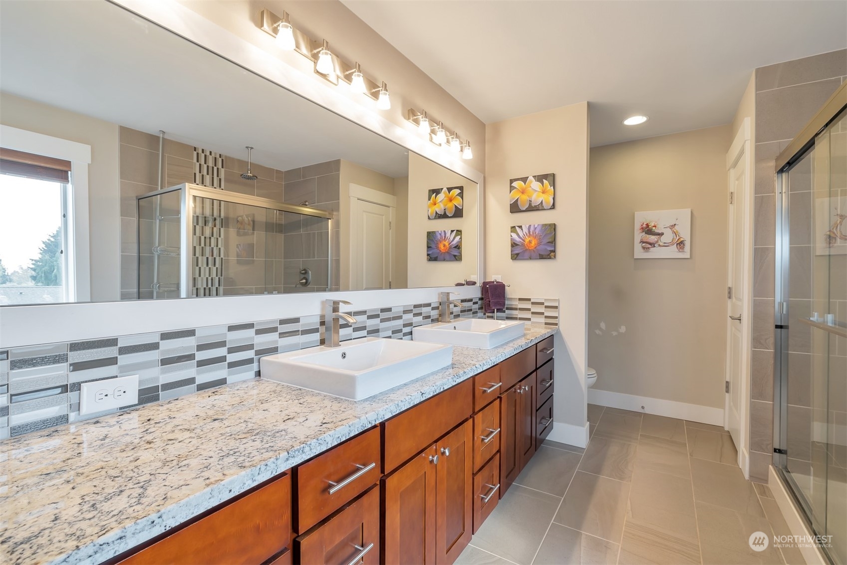 13508 6th Avenue Southwest Burien, WA 98146 - Photo 31 of 39 a bathroom with a sink double vanity granite and a mirror