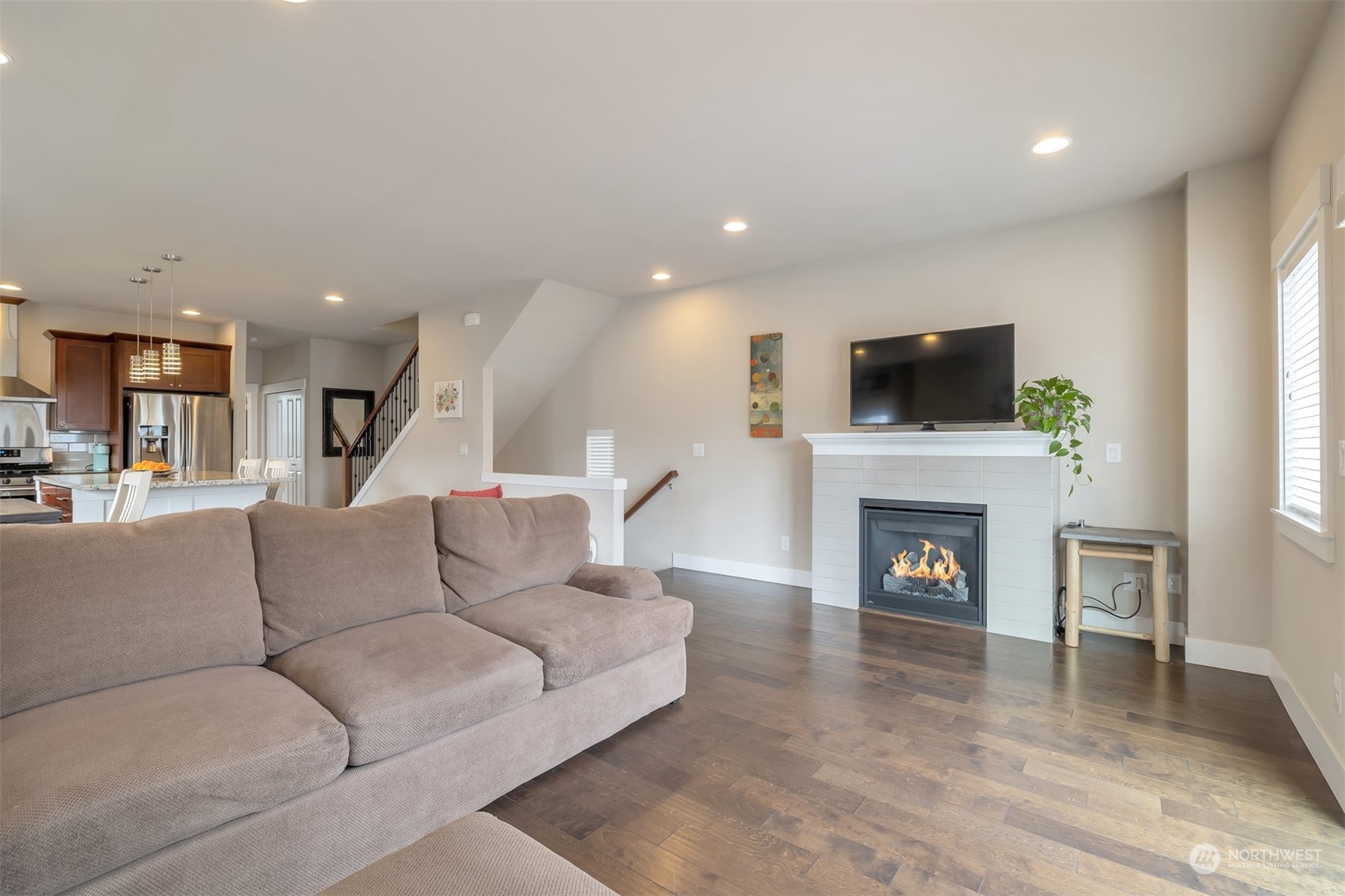 13508 6th Avenue Southwest Burien, WA 98146 - Photo 4 of 39 a living room with furniture a fireplace and a flat screen tv