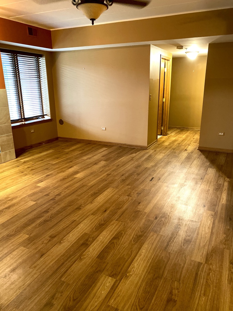 2321 183rd Street, Unit 101 Homewood, IL 60430 - Photo 11 of 27 a view of a room with wooden floor