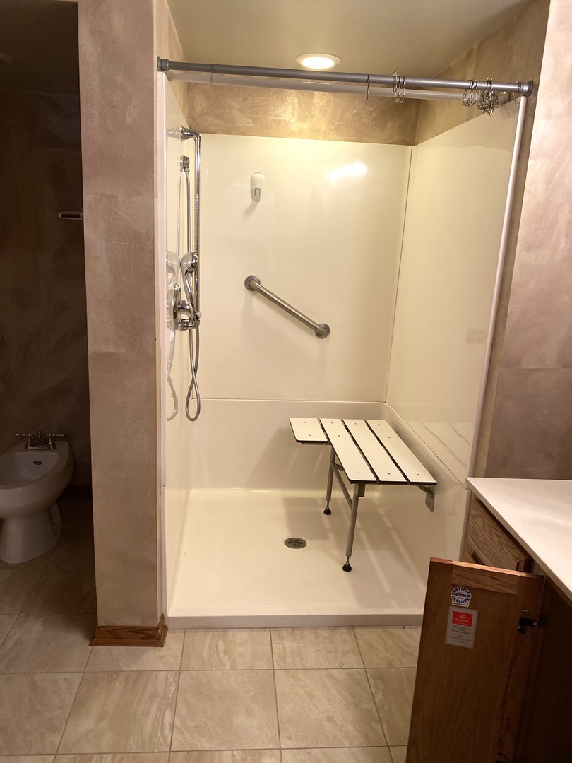 2321 183rd Street, Unit 101 Homewood, IL 60430 - Photo 23 of 27 a bathroom with a shower and a bath tub