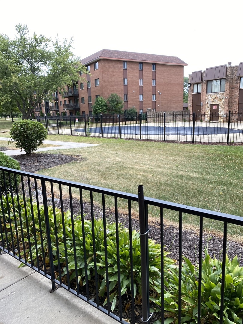 2321 183rd Street, Unit 101 Homewood, IL 60430 - Photo 25 of 27 a view of building with yard and lake view