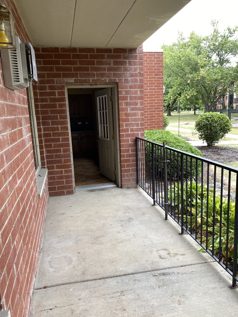2321 183rd Street, Unit 101 Homewood, IL 60430 - Photo 26 of 27 a front view of a house with a garage