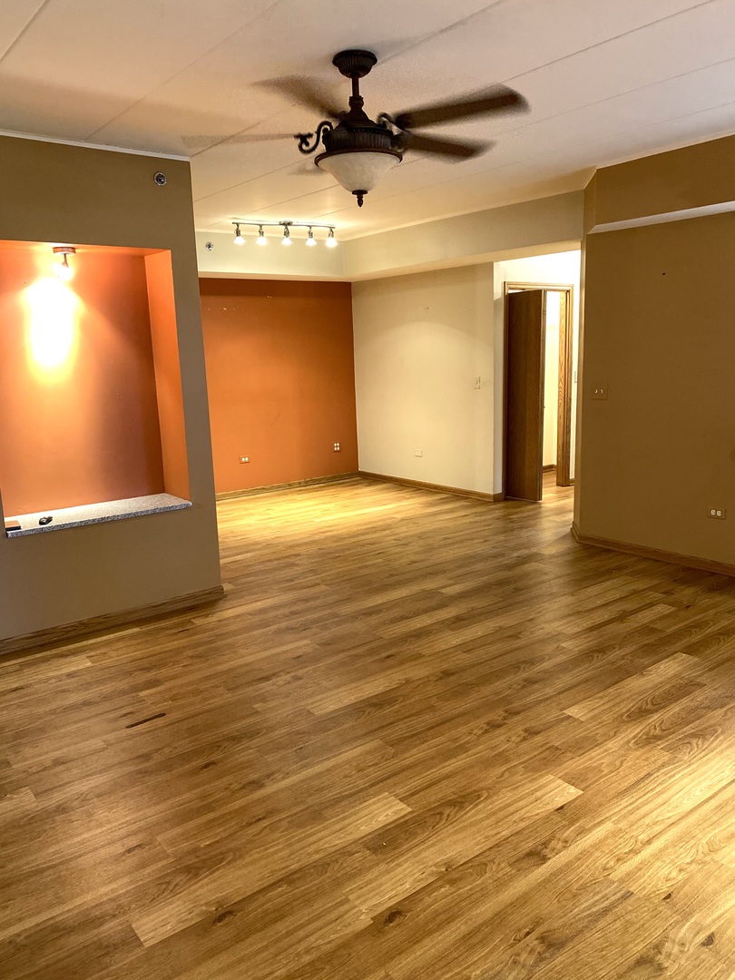 2321 183rd Street, Unit 101 Homewood, IL 60430 - Photo 5 of 27 a view of empty room with wooden floor