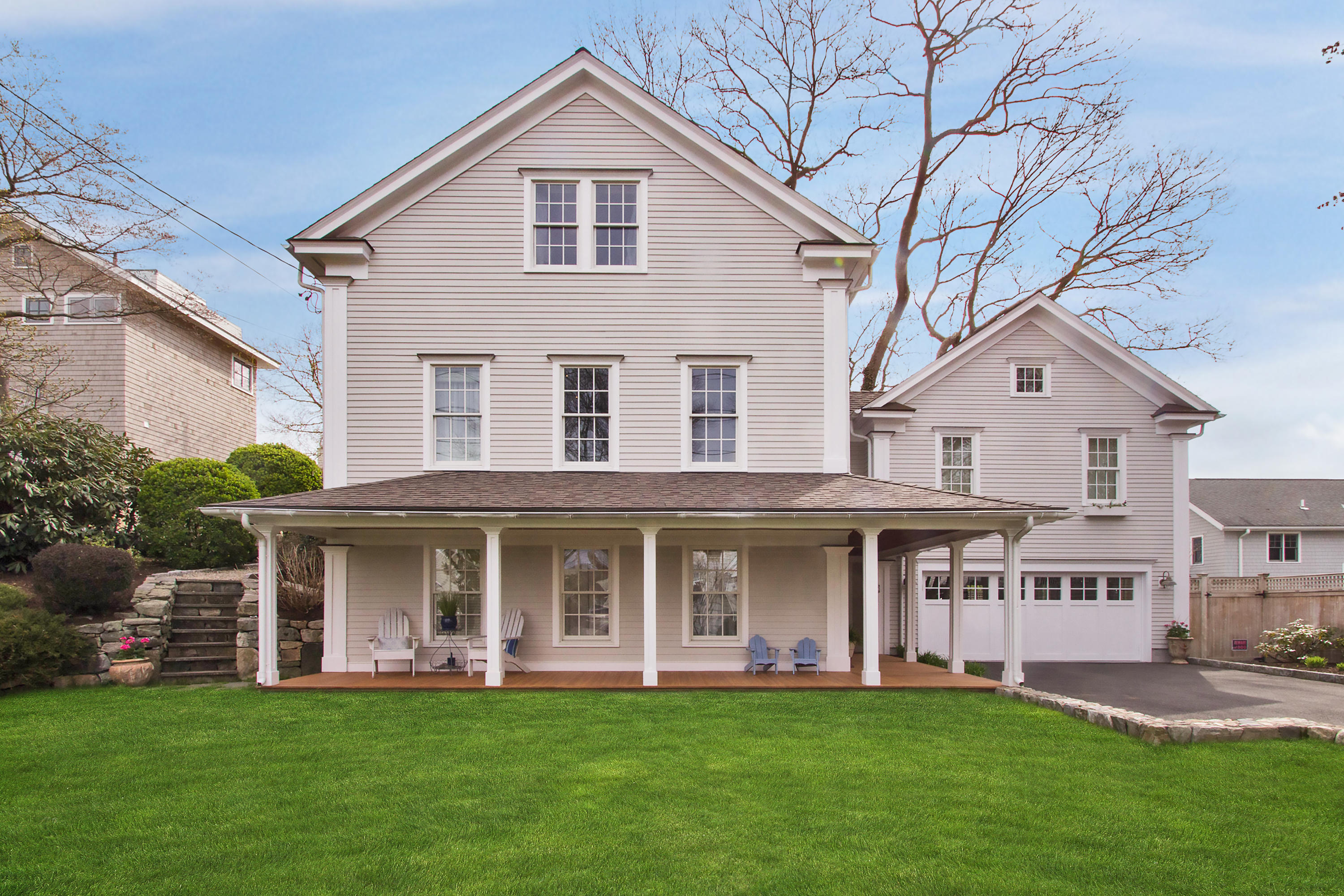 7 Ensign Road Norwalk, CT 06853 - Photo 1 of 25 a front view of a house with a garden and deck