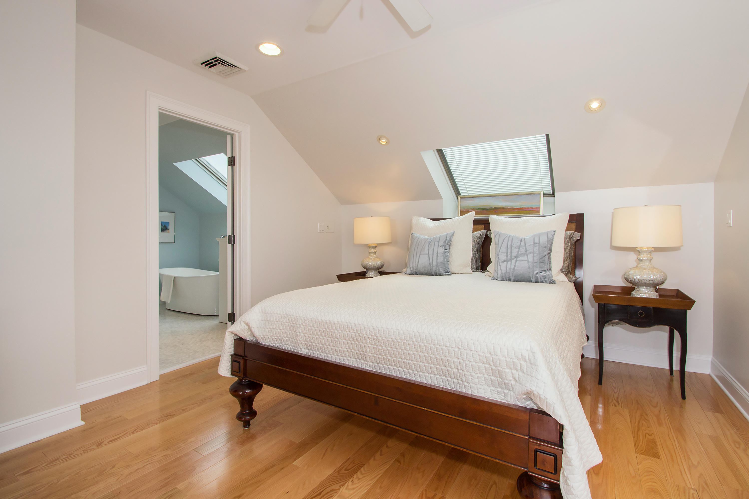 7 Ensign Road Norwalk, CT 06853 - Photo 12 of 25 a bedroom with a bed and a lamp