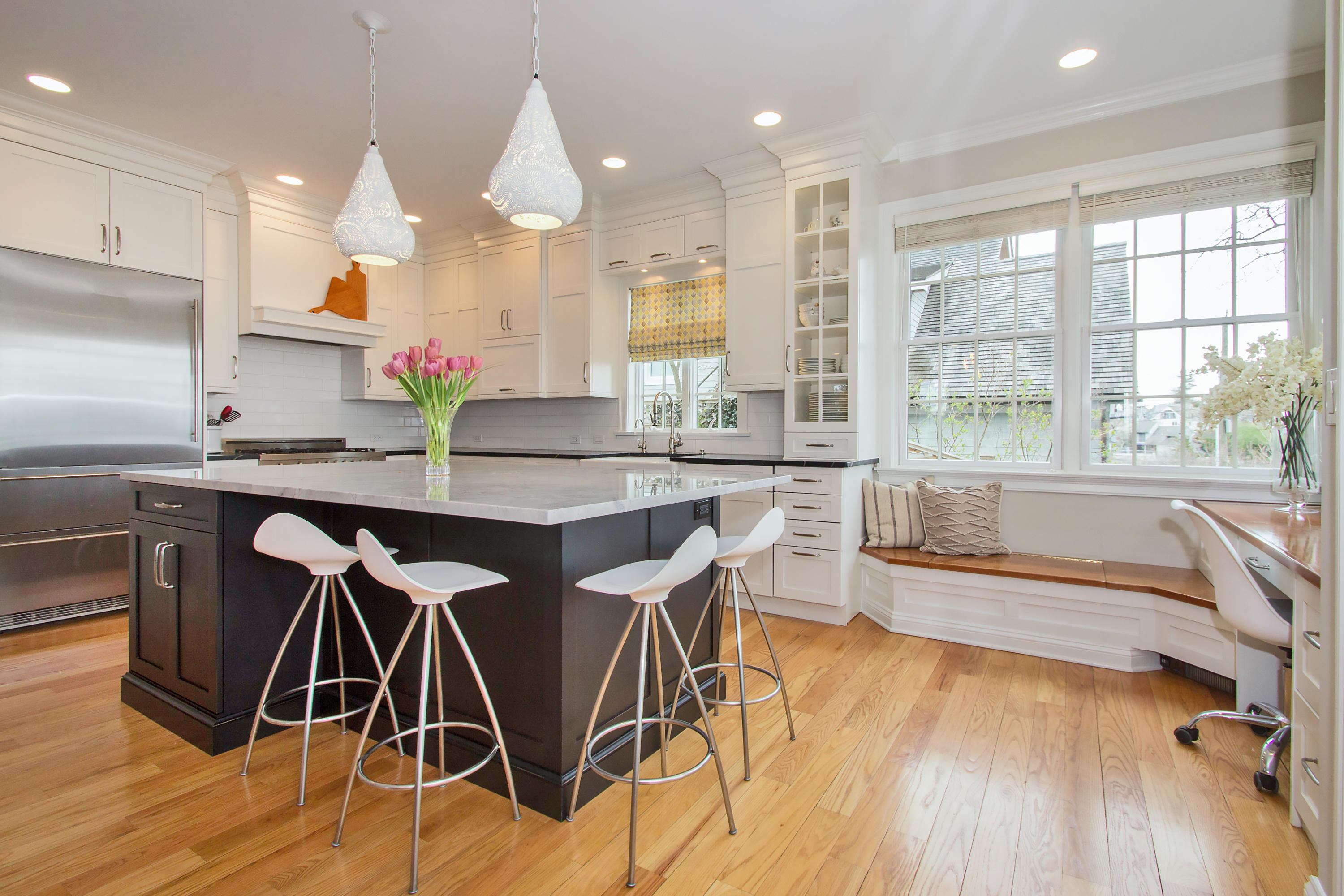 7 Ensign Road Norwalk, CT 06853 - Photo 8 of 25 a dining hall with stainless steel appliances granite countertop a kitchen island a stove a sink and a dining table with wooden floor