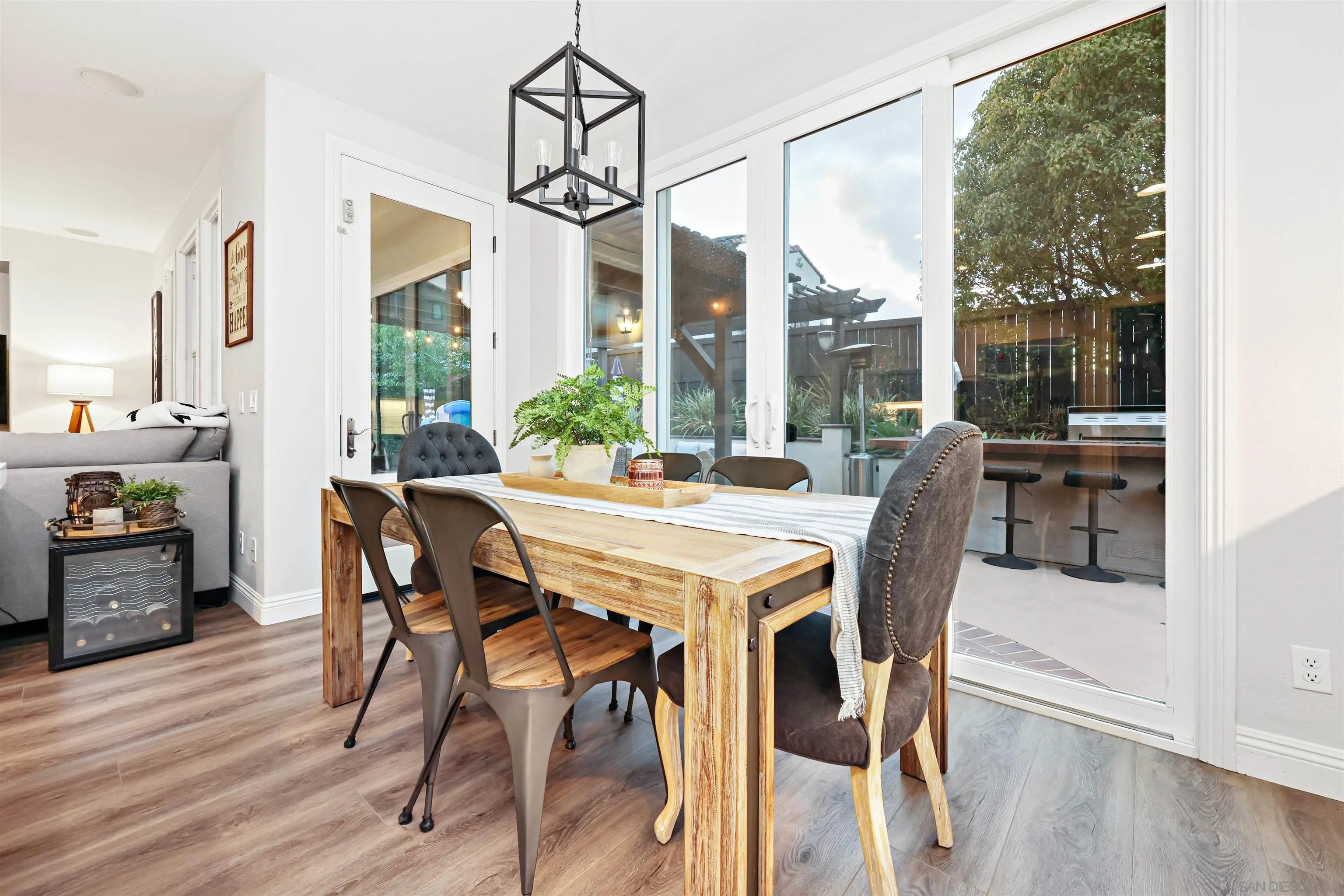 1431 Eclipse Drive San Marcos, CA 92078 - Photo 13 of 39 a view of a dining room with furniture window and wooden floor