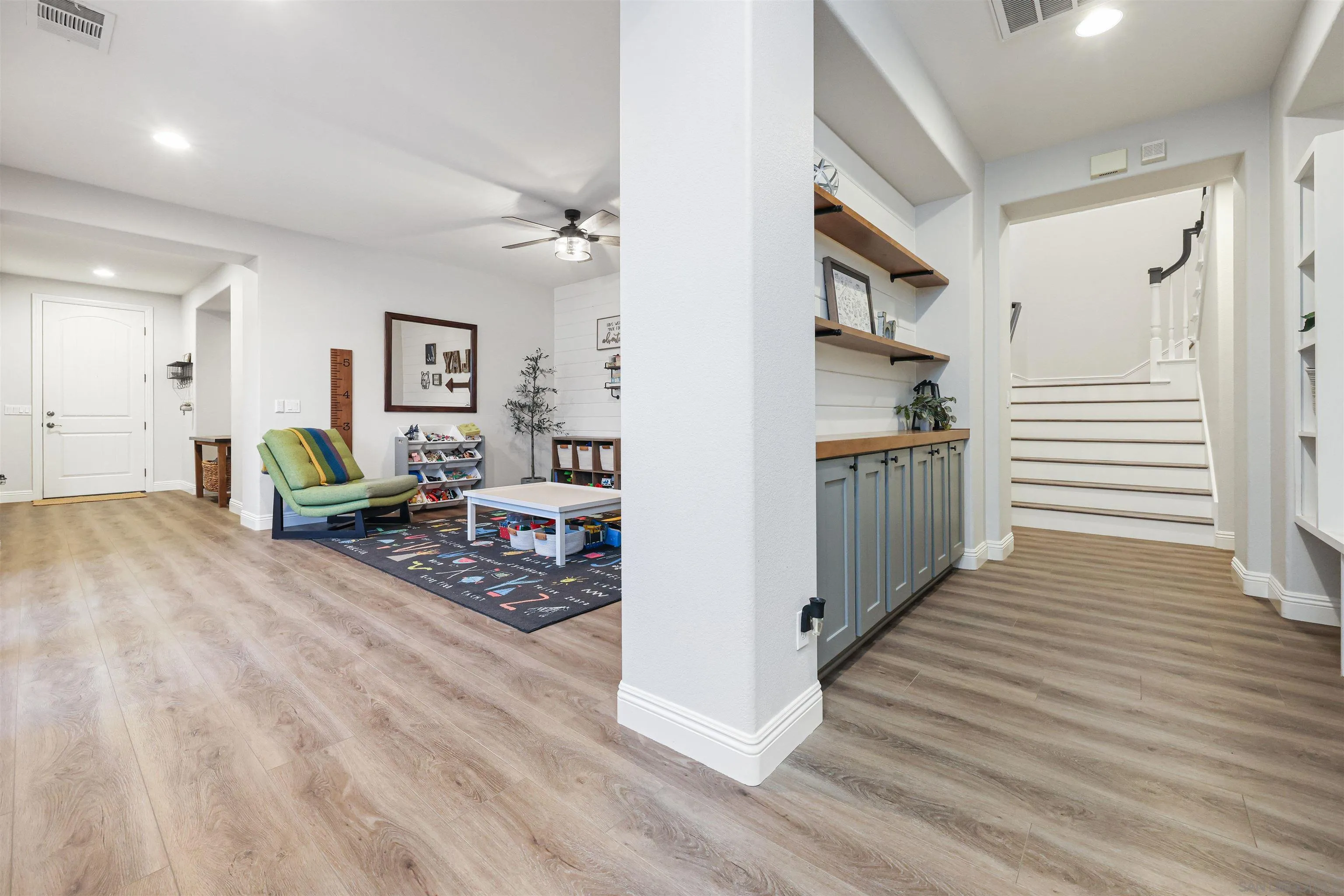 1431 Eclipse Drive San Marcos, CA 92078 - Photo 20 of 39 a view of a hallway view with wooden floor and furniture