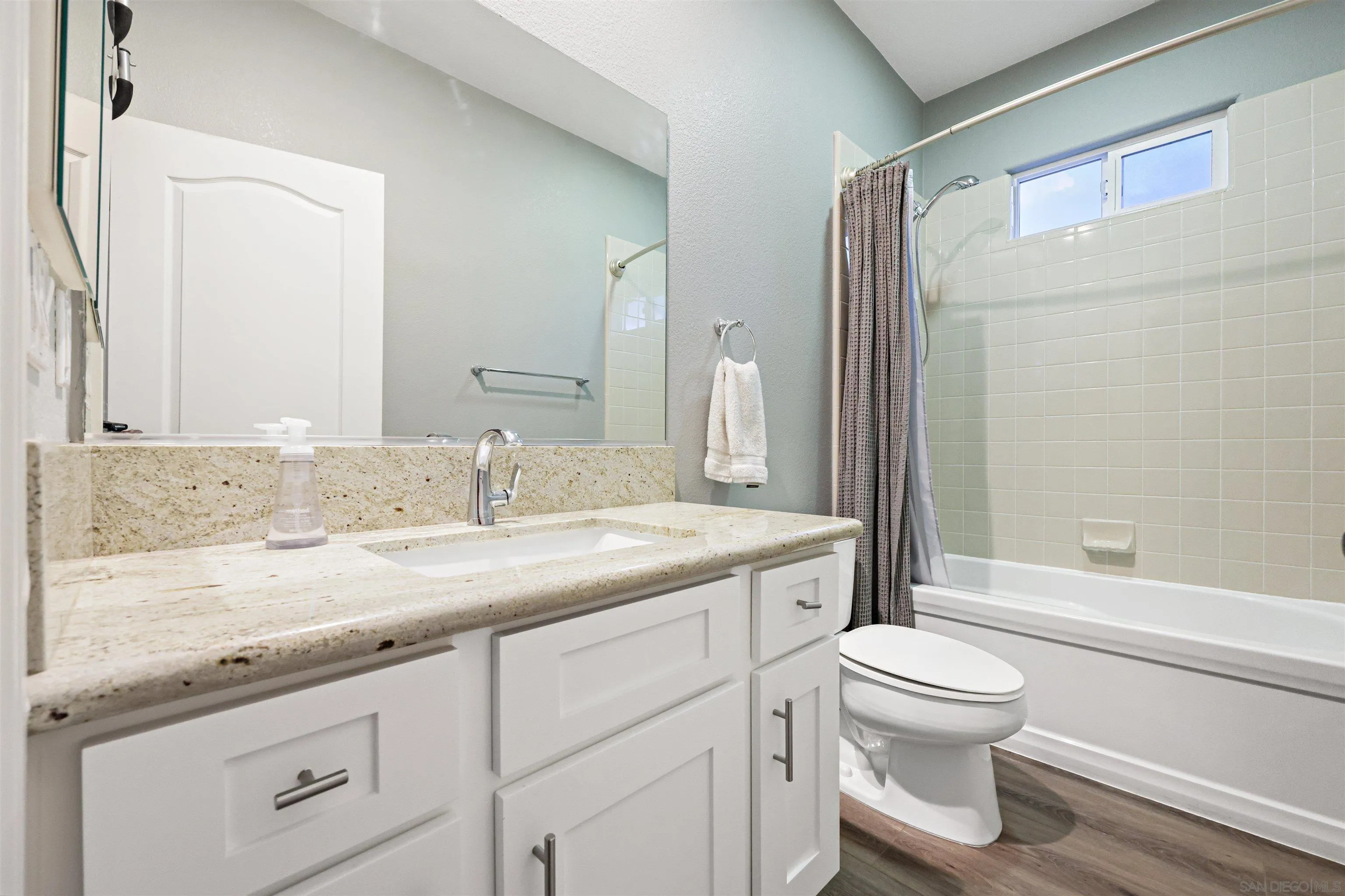 1431 Eclipse Drive San Marcos, CA 92078 - Photo 22 of 39 a bathroom with a granite countertop sink toilet and shower