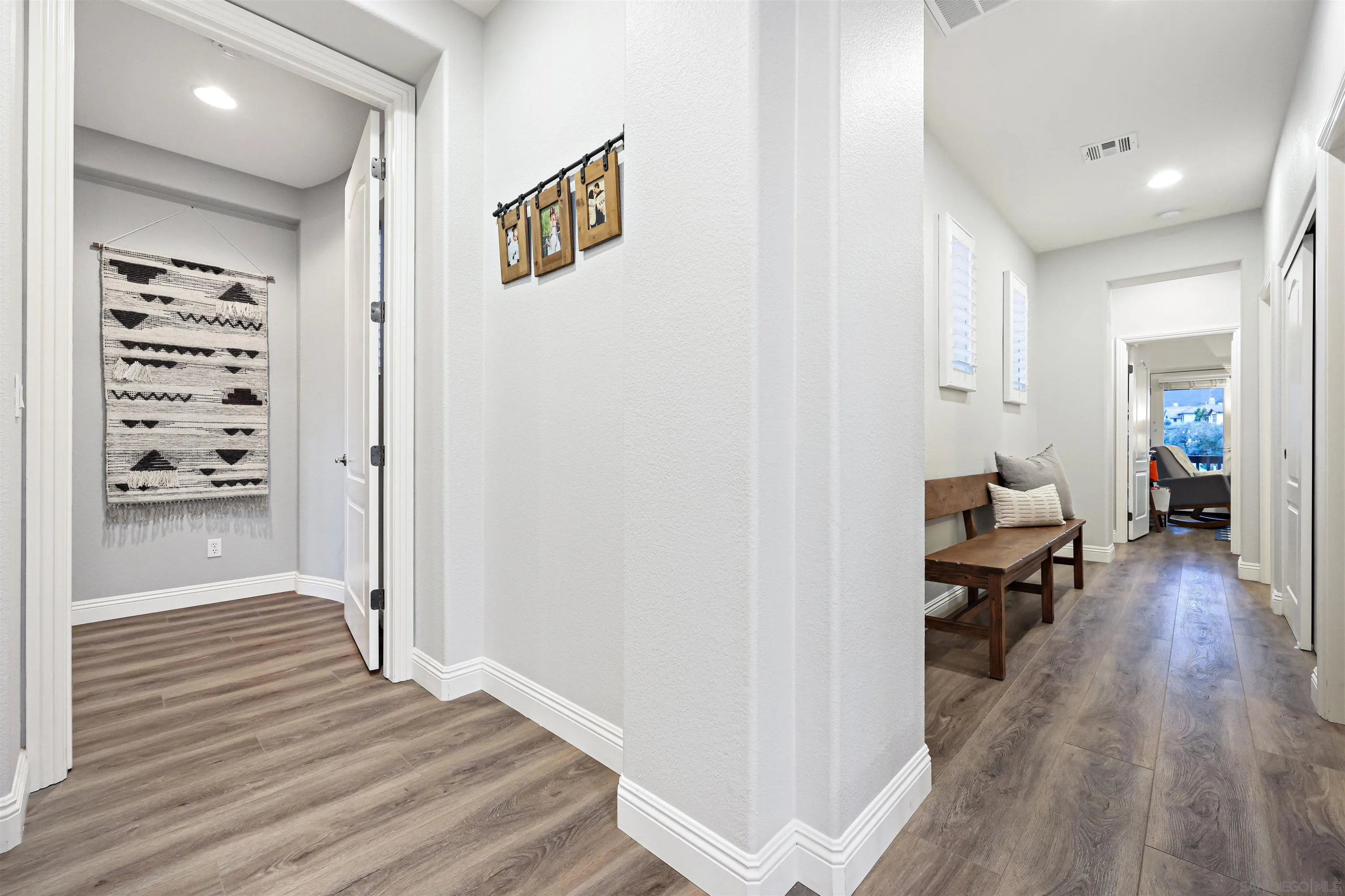 1431 Eclipse Drive San Marcos, CA 92078 - Photo 23 of 39 a living room with furniture and a wooden floor