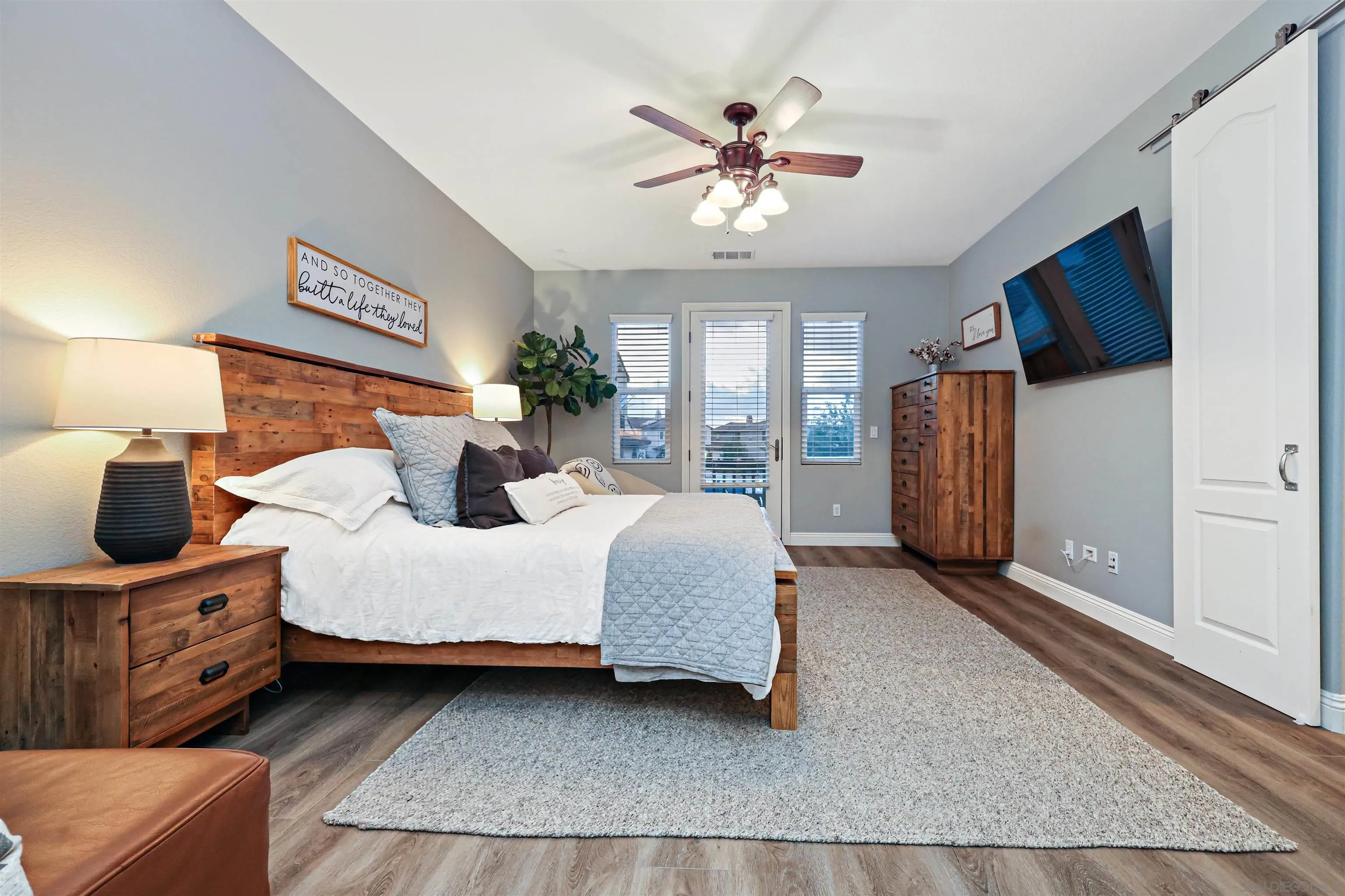 1431 Eclipse Drive San Marcos, CA 92078 - Photo 25 of 39 a bed room with a bed and a chandelier