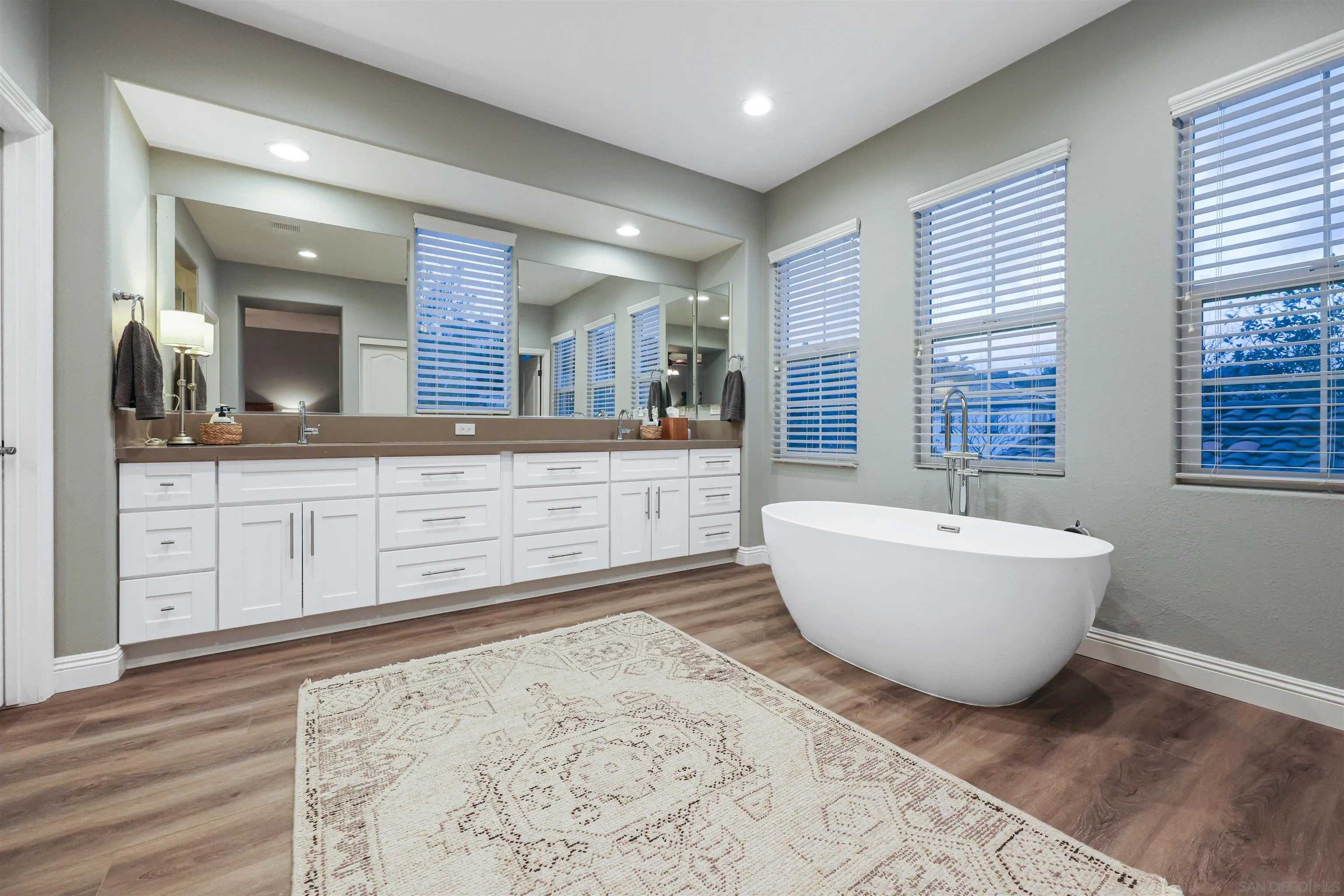 1431 Eclipse Drive San Marcos, CA 92078 - Photo 26 of 39 a spacious bathroom with a bathtub and a sink