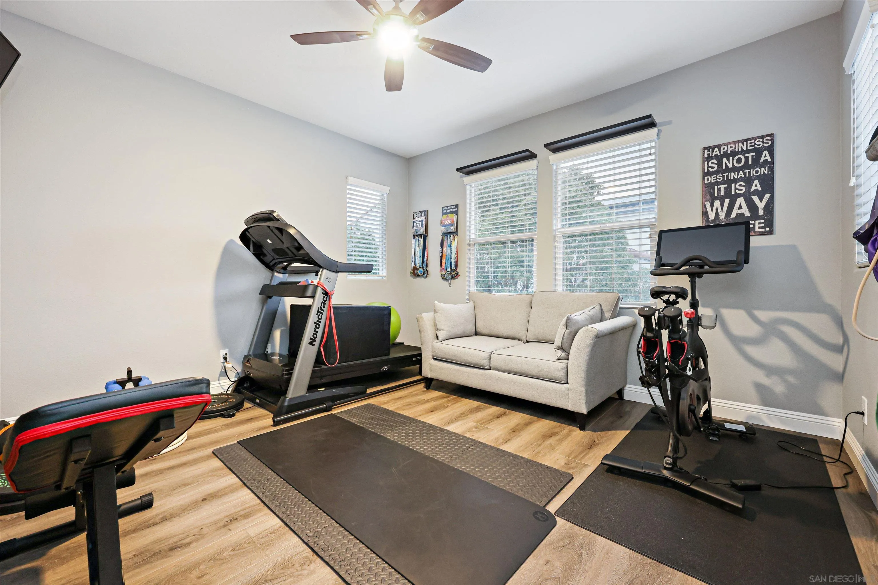 1431 Eclipse Drive San Marcos, CA 92078 - Photo 30 of 39 a living room with furniture gym equipment and a view of living room
