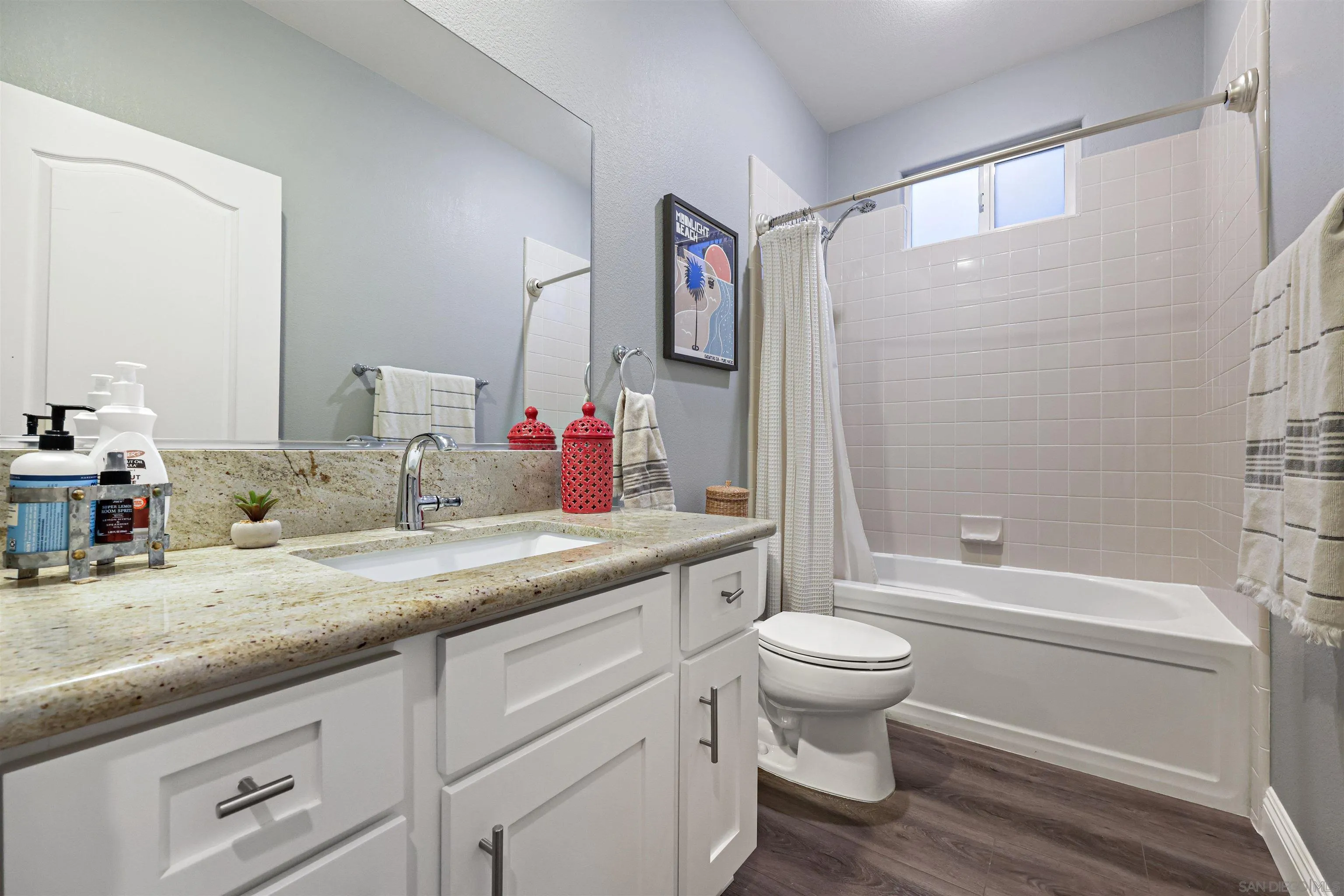 1431 Eclipse Drive San Marcos, CA 92078 - Photo 31 of 39 a bathroom with a granite countertop sink toilet and shower