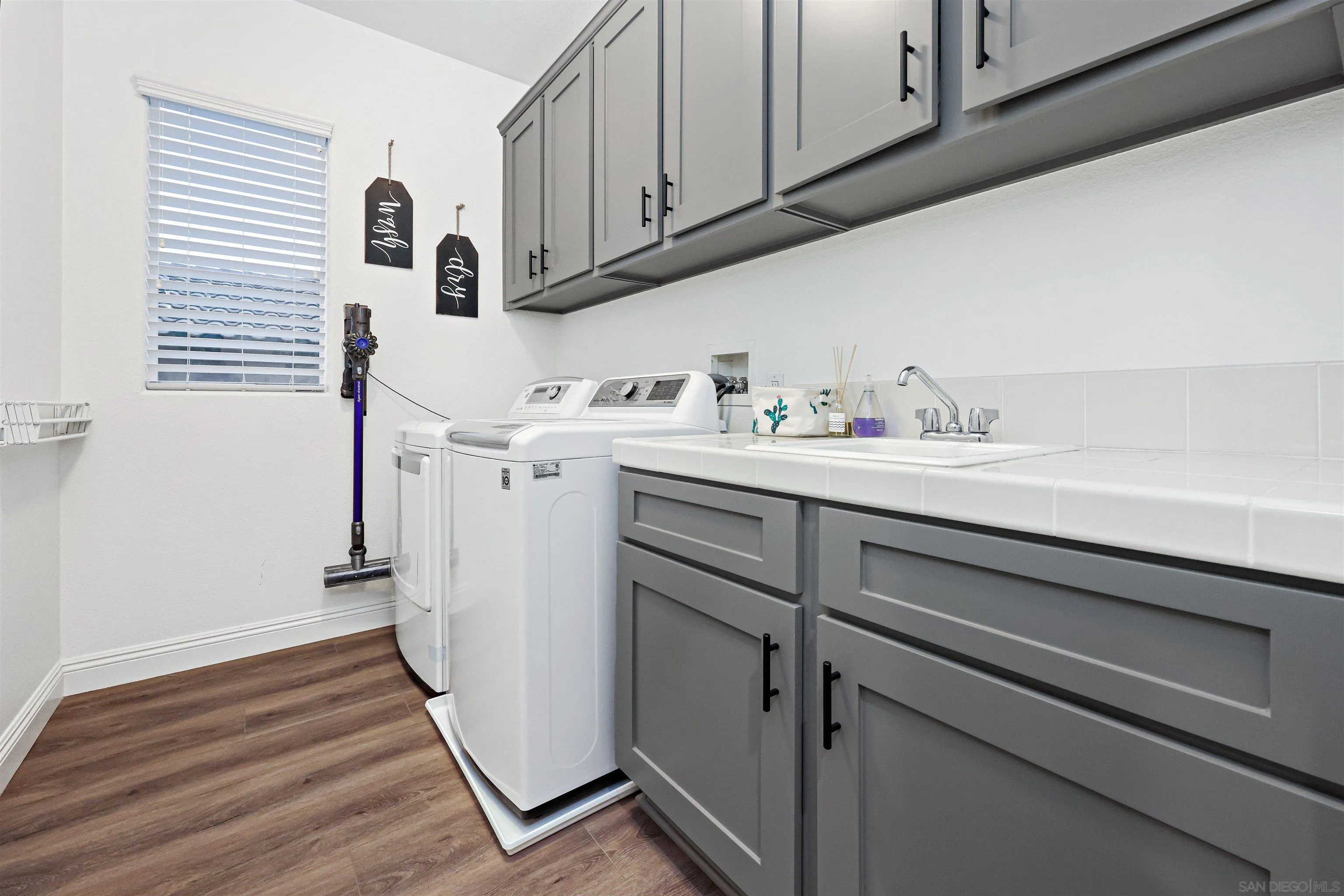 1431 Eclipse Drive San Marcos, CA 92078 - Photo 36 of 39 a view of a storage and utility room with washer and dryer