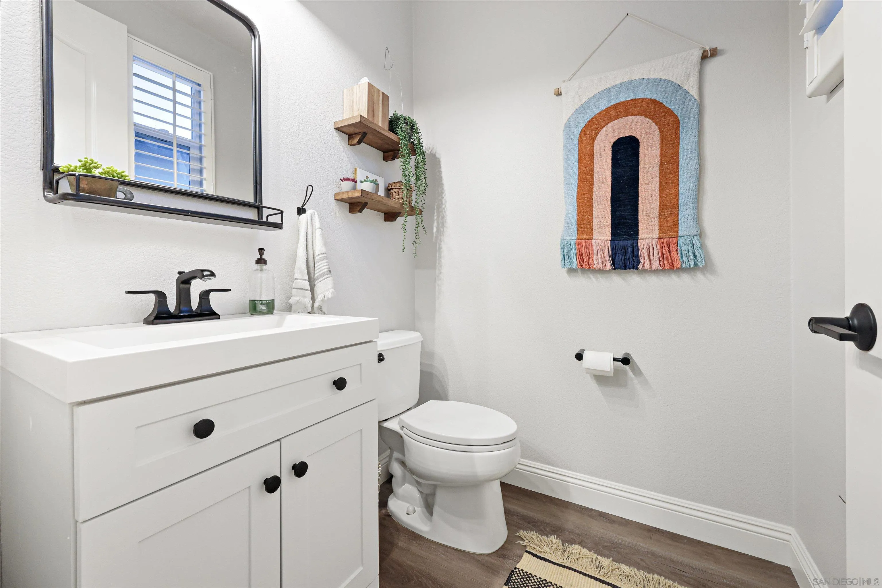 1431 Eclipse Drive San Marcos, CA 92078 - Photo 6 of 39 a bathroom with a sink and mirror