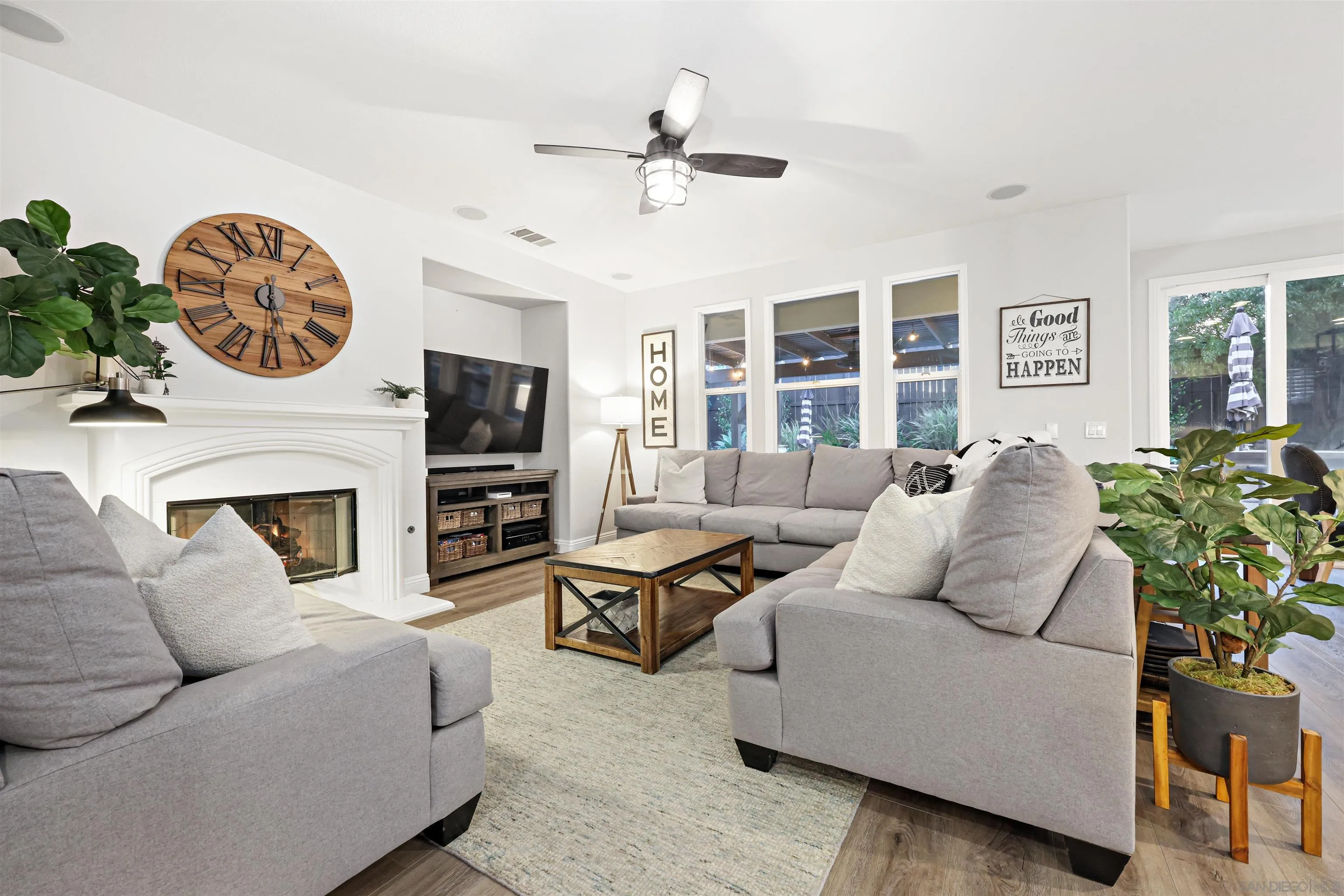 1431 Eclipse Drive San Marcos, CA 92078 - Photo 9 of 39 a living room with furniture a fireplace and a flat screen tv