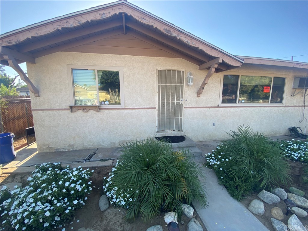 4571 Glen Street Riverside, CA 92509 - Photo 1 of 1 a front view of a house with garden