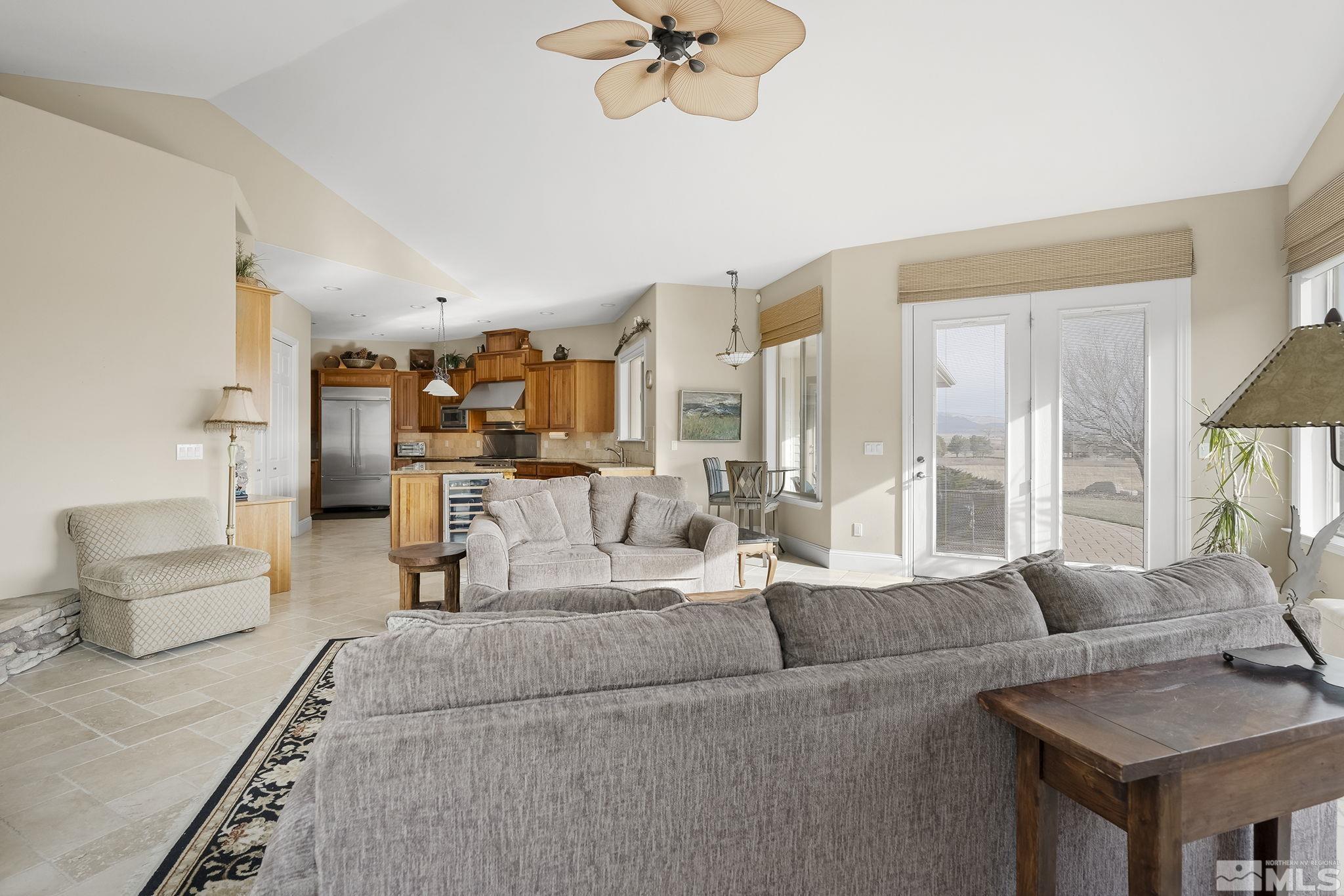 2425 Genoa Meadows Circle Genoa, NV 89411 - Photo 13 of 40 a living room with furniture and a large window