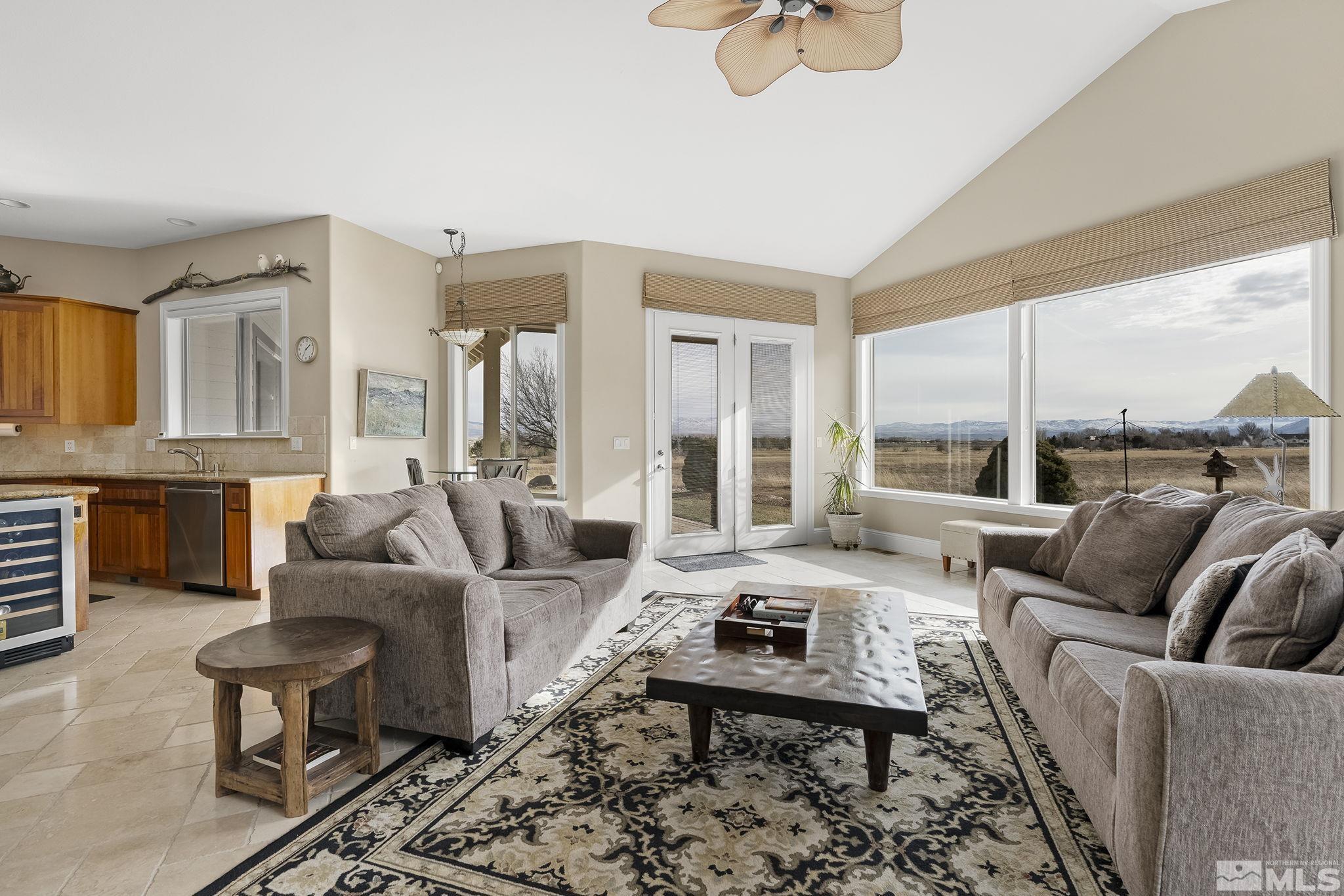 2425 Genoa Meadows Circle Genoa, NV 89411 - Photo 14 of 40 a living room with furniture wooden floor and a large window
