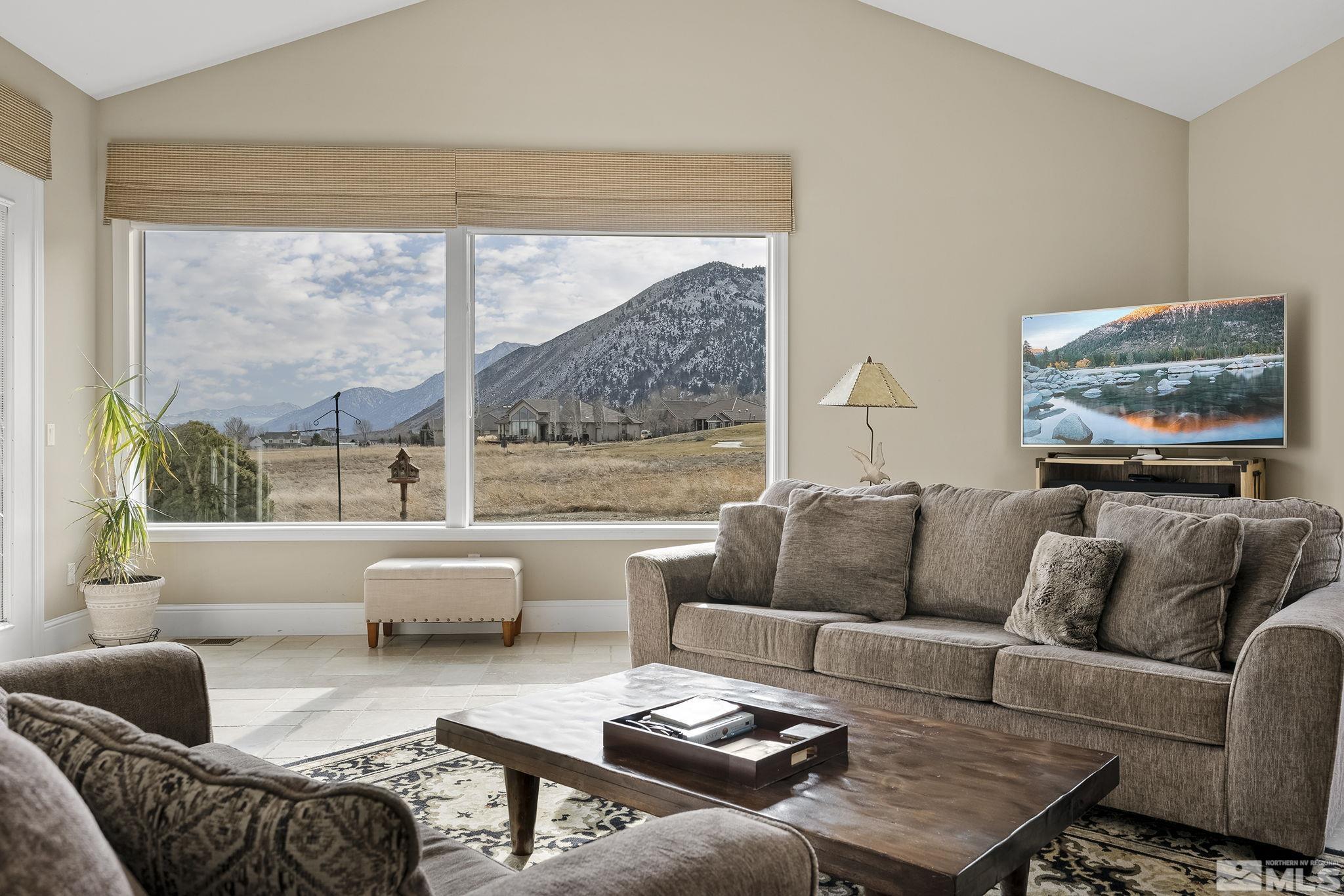 2425 Genoa Meadows Circle Genoa, NV 89411 - Photo 15 of 40 a living room with furniture and a large window