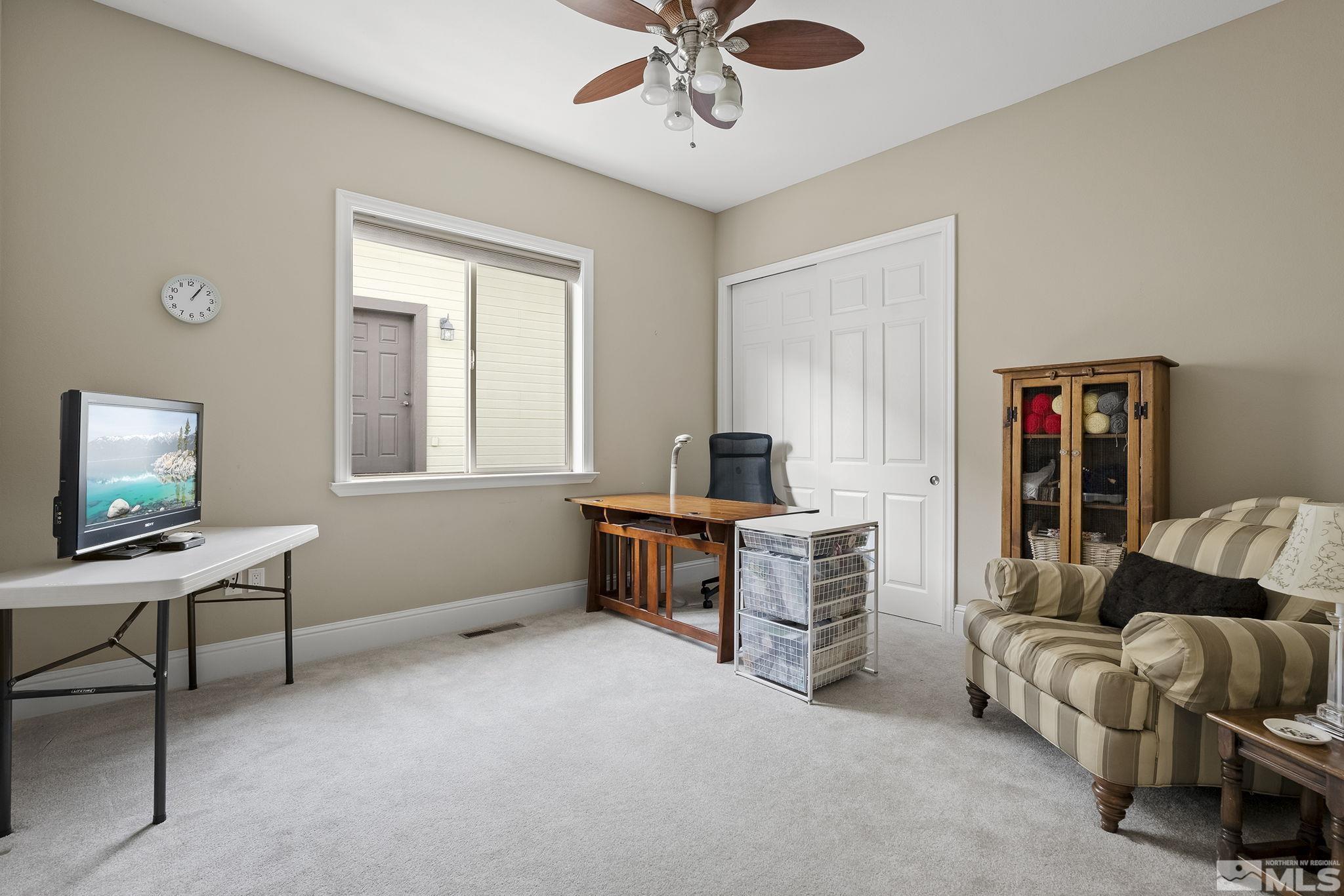 2425 Genoa Meadows Circle Genoa, NV 89411 - Photo 26 of 40 a living room with furniture and a window
