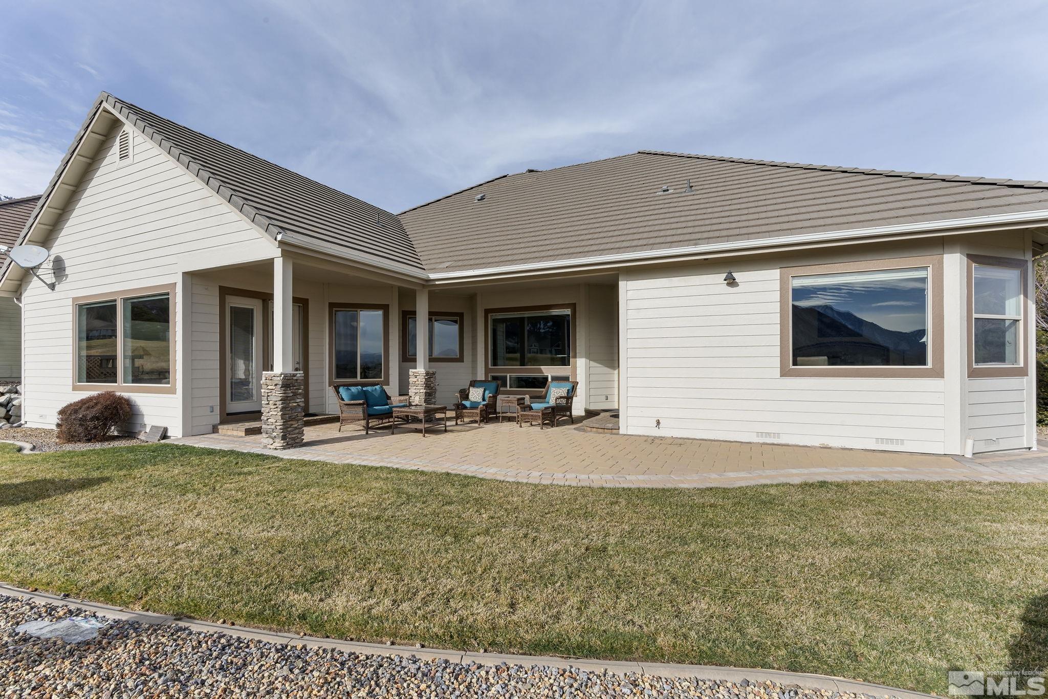 2425 Genoa Meadows Circle Genoa, NV 89411 - Photo 30 of 40 a front view of a house with basket ball court and porch