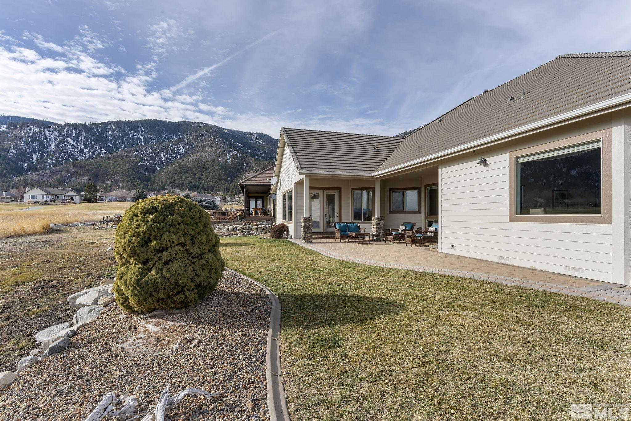2425 Genoa Meadows Circle Genoa, NV 89411 - Photo 31 of 40 a swimming pool with outdoor seating and yard