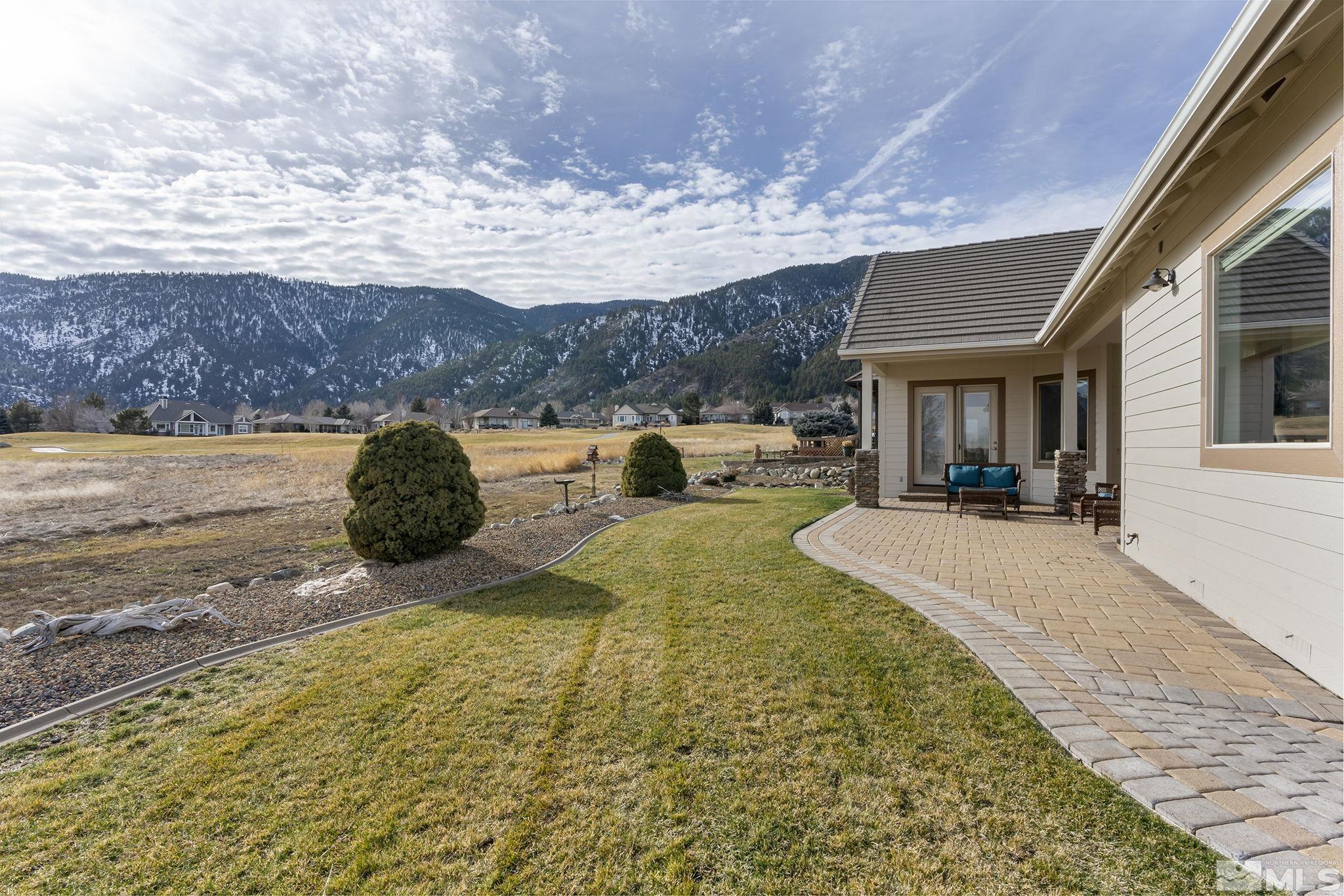2425 Genoa Meadows Circle Genoa, NV 89411 - Photo 32 of 40 a swimming pool with barbeque oven