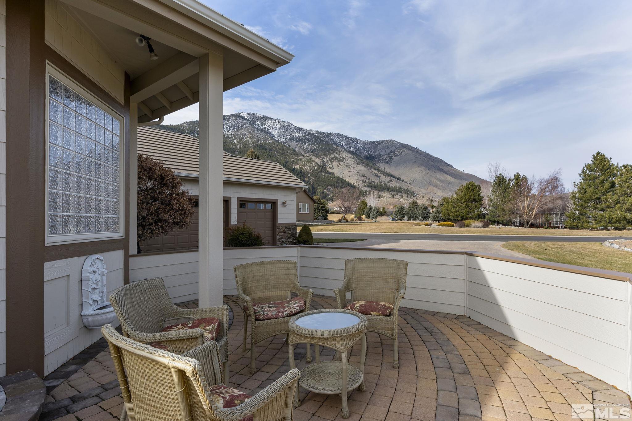 2425 Genoa Meadows Circle Genoa, NV 89411 - Photo 35 of 40 a view of a terrace with couches and pool