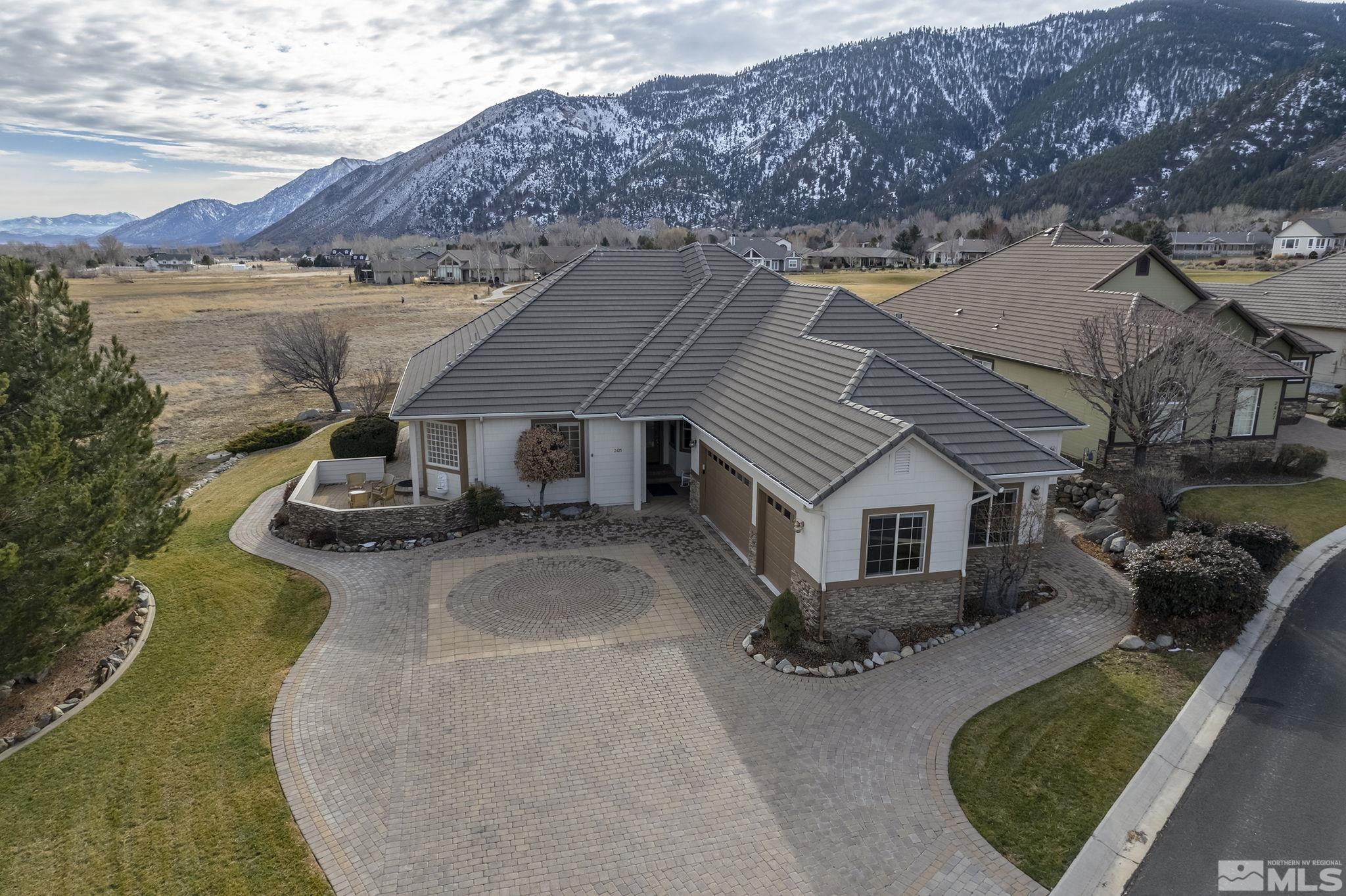 2425 Genoa Meadows Circle Genoa, NV 89411 - Photo 39 of 40 an aerial view of a house with yard