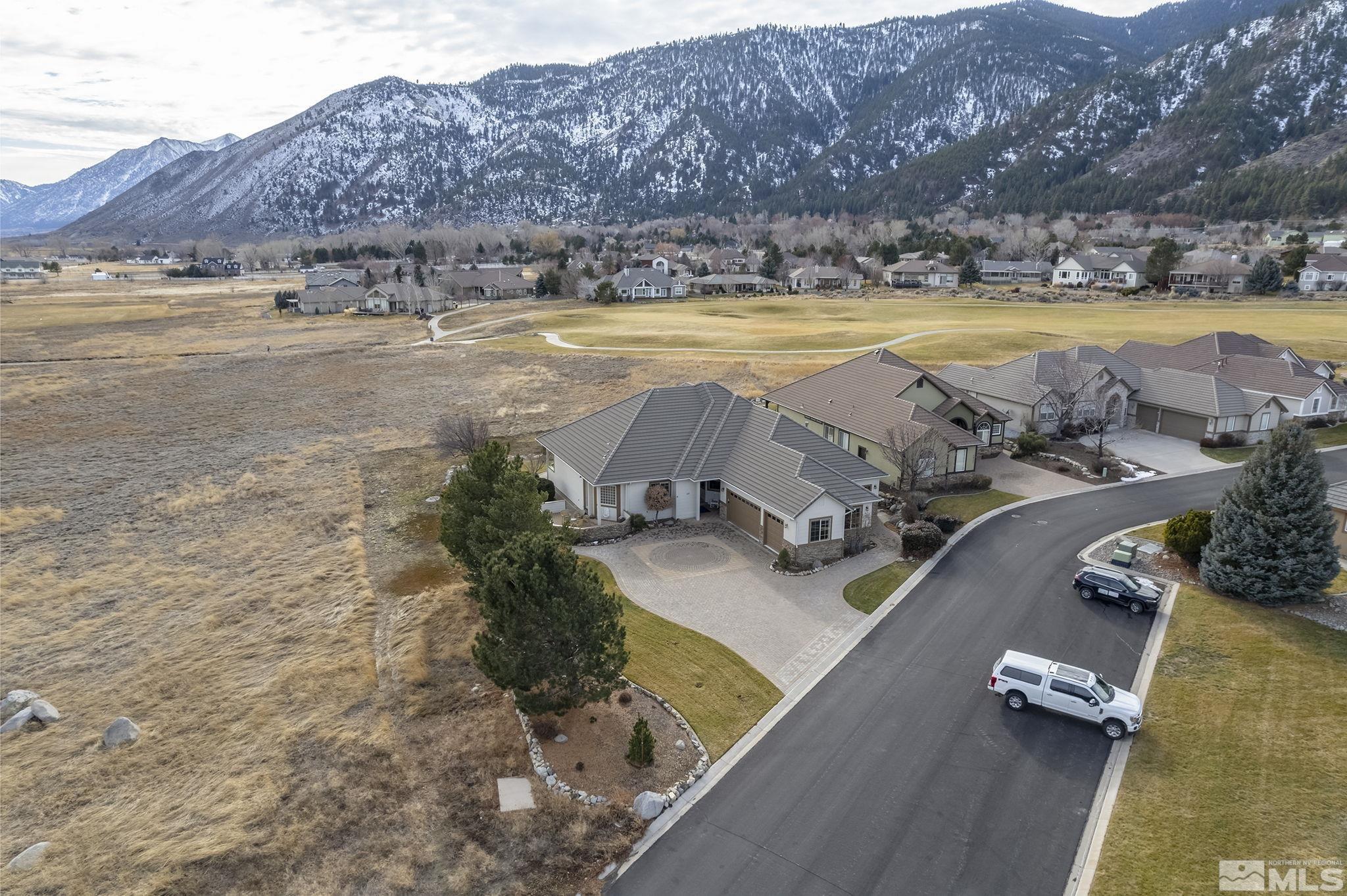 2425 Genoa Meadows Circle Genoa, NV 89411 - Photo 40 of 40 a view of a swimming pool and mountains