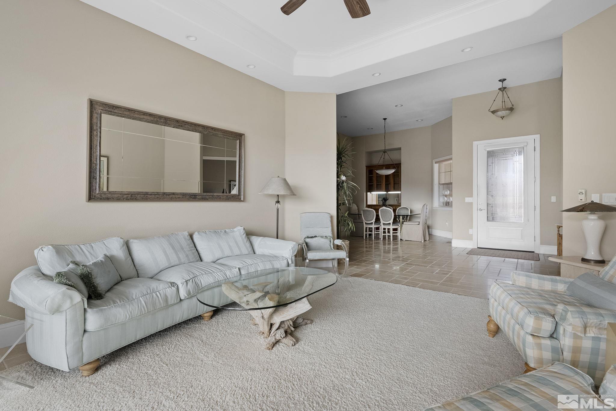 2425 Genoa Meadows Circle Genoa, NV 89411 - Photo 7 of 40 a living room with furniture and wooden floor