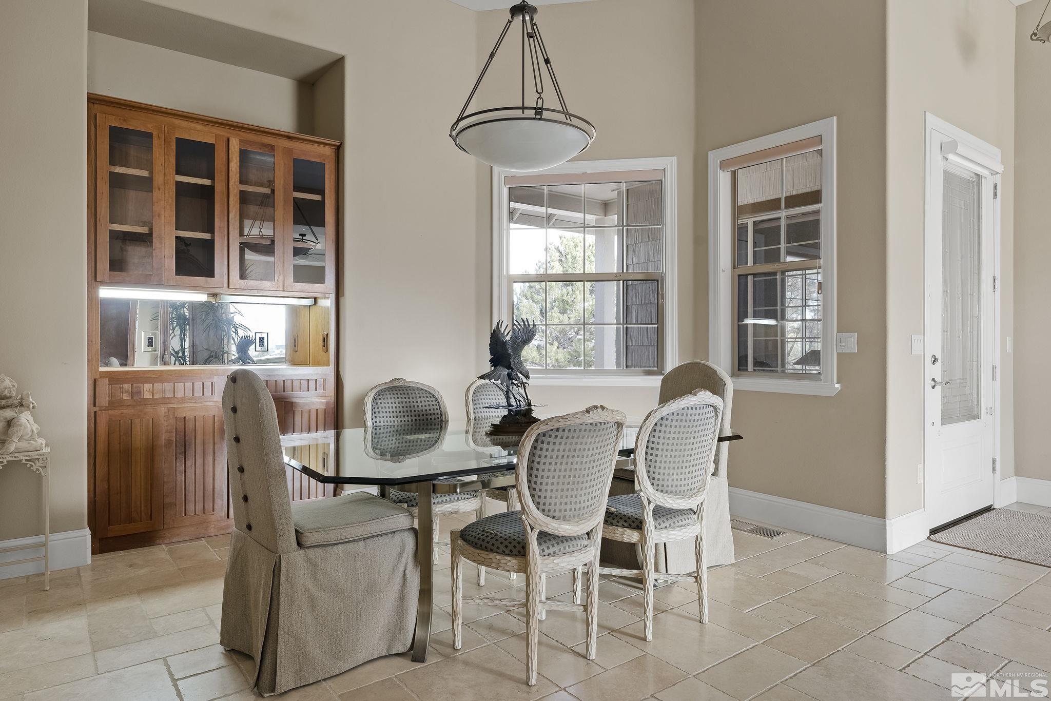 2425 Genoa Meadows Circle Genoa, NV 89411 - Photo 9 of 40 a dining room with furniture and windows