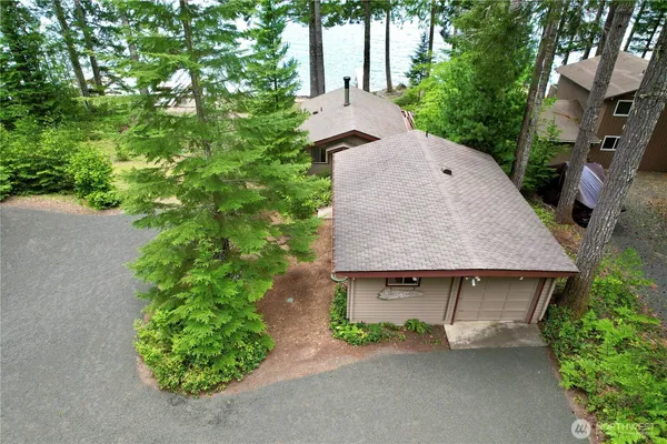 an aerial view of a house with yard and outdoor seating