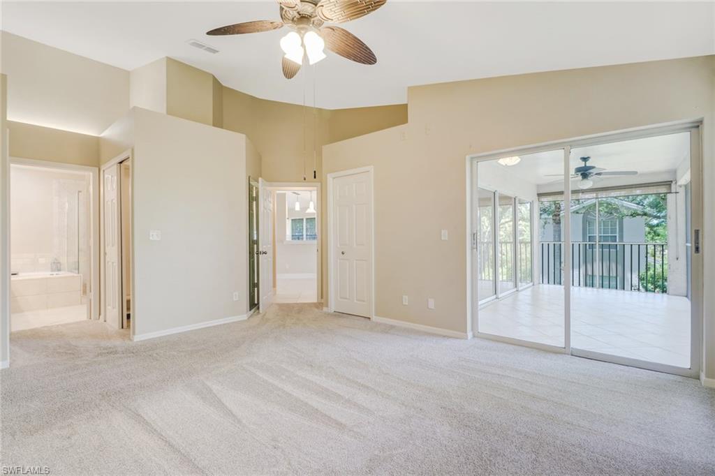 3765 Fieldstone Boulevard, Unit 1304 Naples, FL 34109 - Photo 16 of 33 a view of an empty room with a window