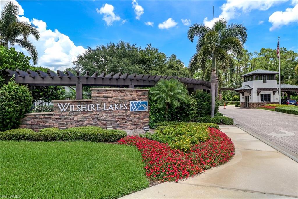 3765 Fieldstone Boulevard, Unit 1304 Naples, FL 34109 - Photo 28 of 33 a view of an house with backyard space and garden