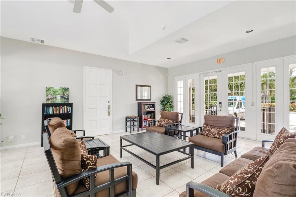 3765 Fieldstone Boulevard, Unit 1304 Naples, FL 34109 - Photo 31 of 33 a living room with furniture