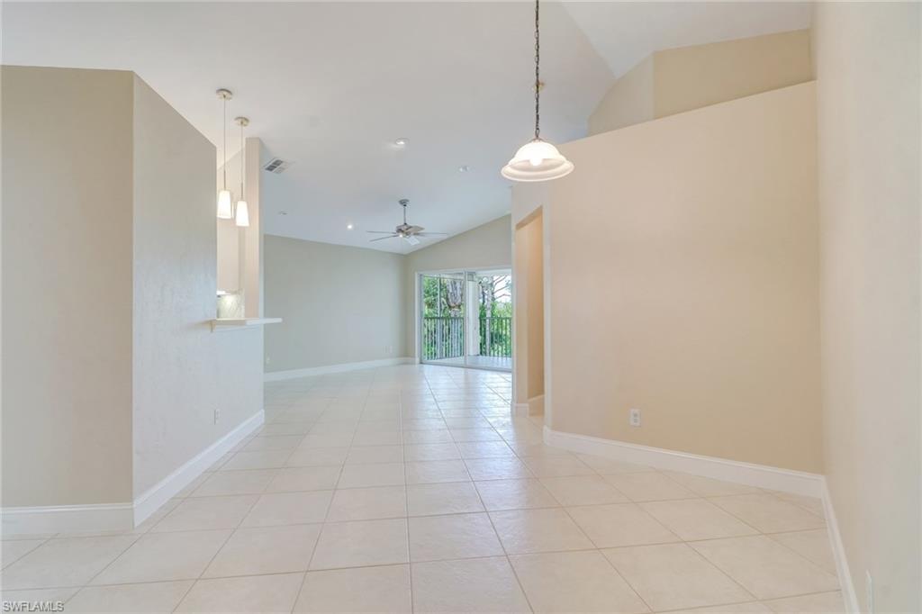 3765 Fieldstone Boulevard, Unit 1304 Naples, FL 34109 - Photo 4 of 33 a view of an empty room with a window