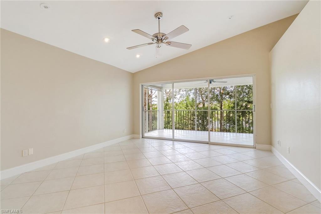 3765 Fieldstone Boulevard, Unit 1304 Naples, FL 34109 - Photo 5 of 33 a view of an empty room with a window