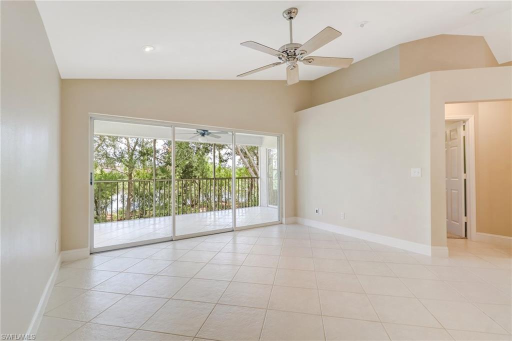3765 Fieldstone Boulevard, Unit 1304 Naples, FL 34109 - Photo 6 of 33 a view of an empty room with a window