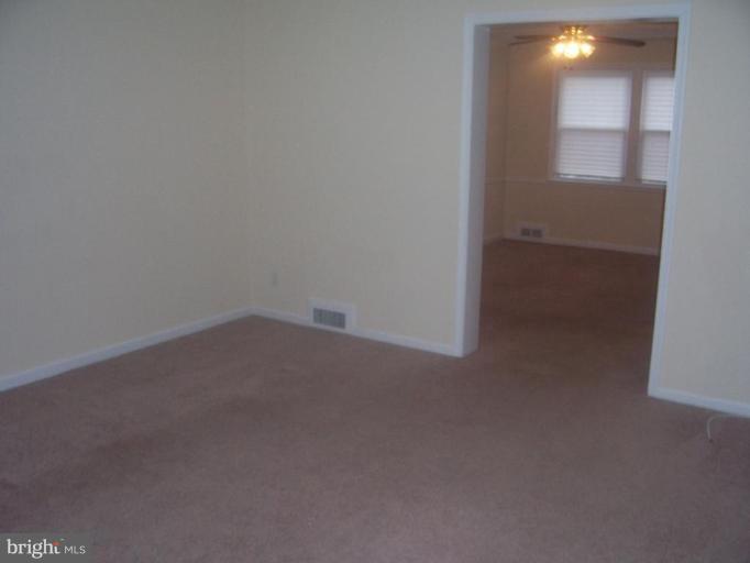 1355 Kitmore Road Baltimore, MD 21239 - Photo 14 of 18 a room that has a window in it