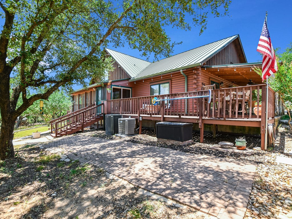 254 Middleton Road Spicewood, TX 78669 - Photo 26 of 32 a view of a house with a yard