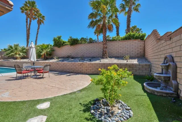 a view of a backyard with a patio