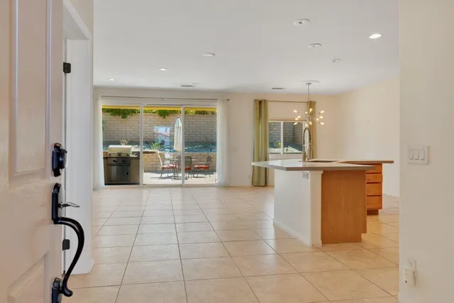 a view of a entryway with furniture and floor to ceiling window