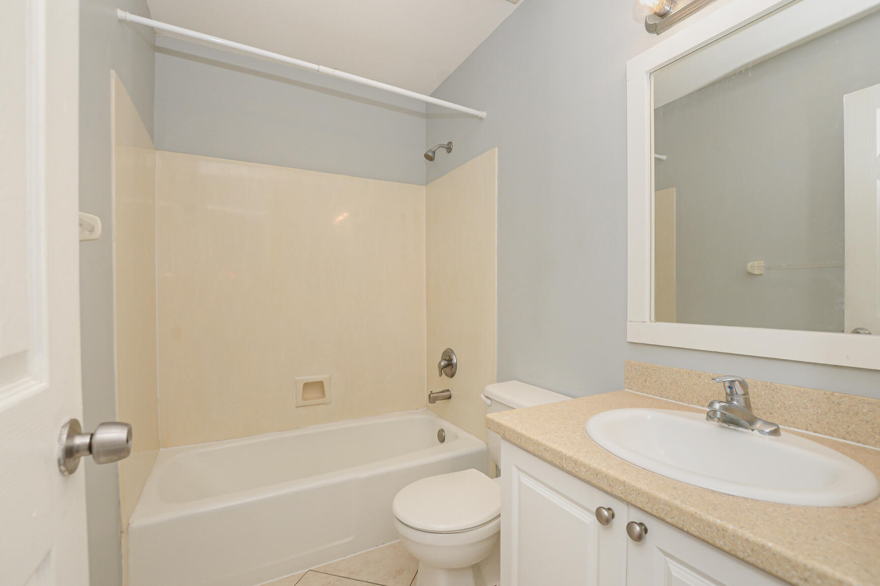 2007 Oleander Boulevard, Unit B Fort Pierce, FL 34950 - Photo 18 of 21 a bathroom with a sink a toilet and shower