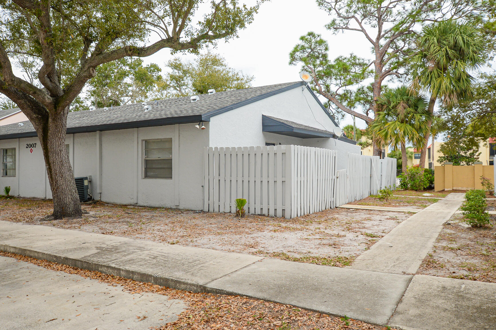 2007 Oleander Boulevard, Unit B Fort Pierce, FL 34950 - Photo 2 of 21 a view of a house with a tree in front of it