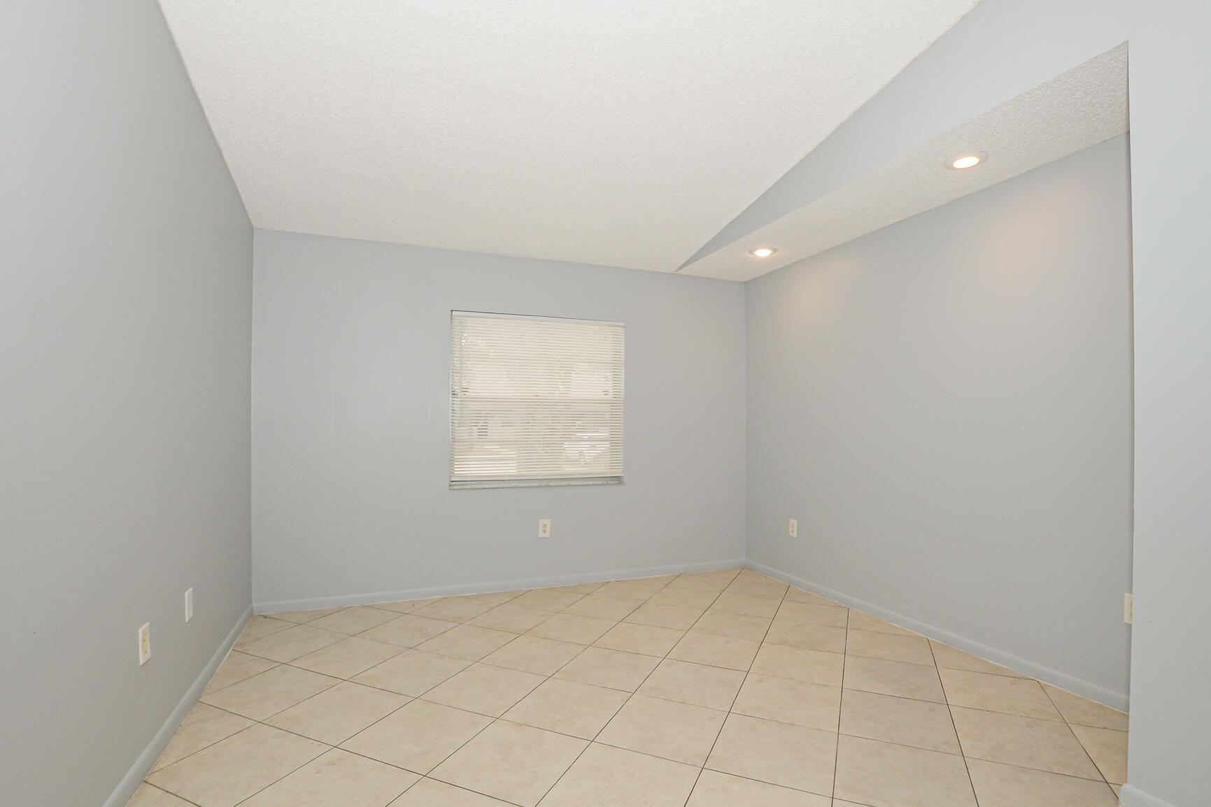 2007 Oleander Boulevard, Unit B Fort Pierce, FL 34950 - Photo 5 of 21 an empty room with a empty space and window