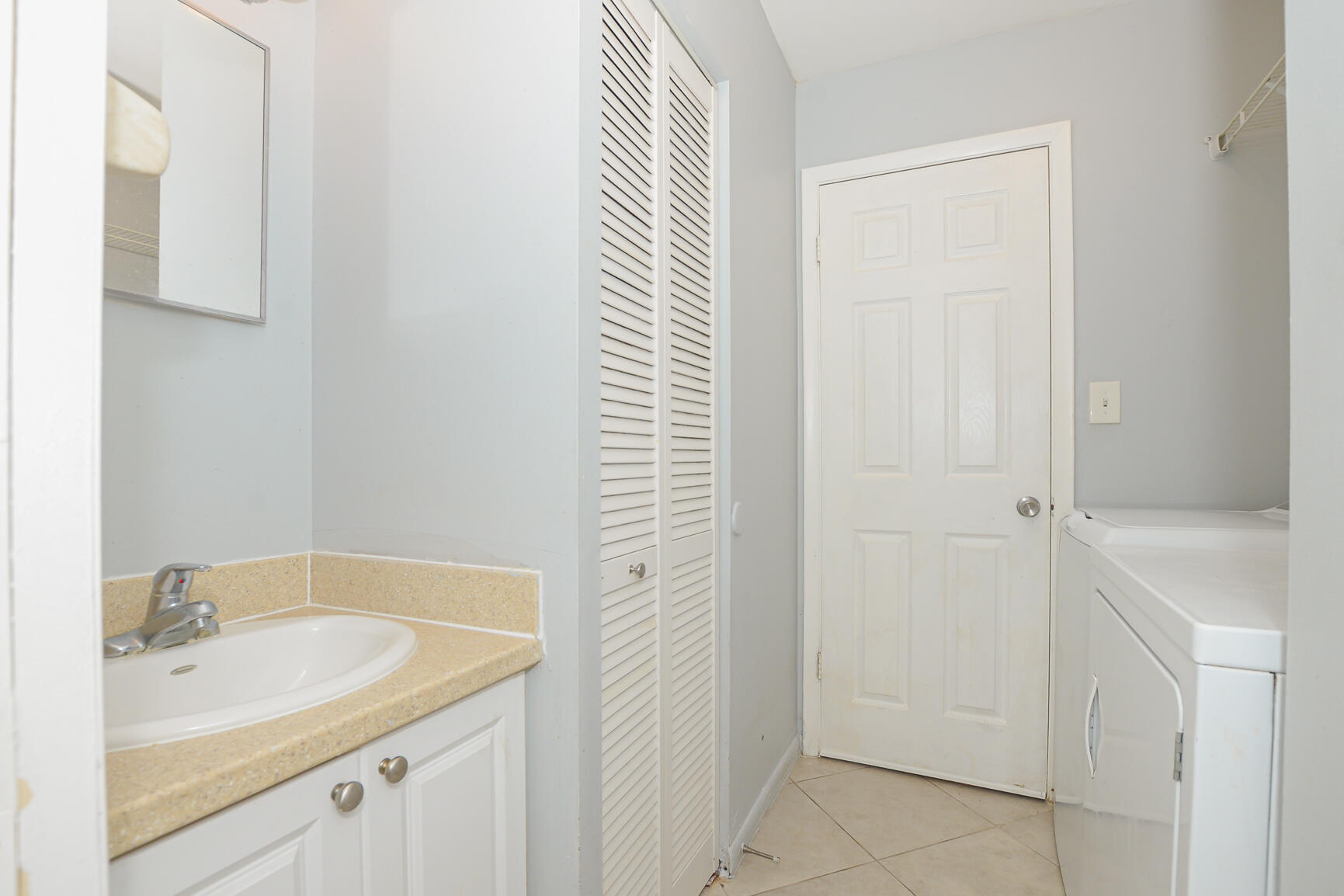 2007 Oleander Boulevard, Unit B Fort Pierce, FL 34950 - Photo 9 of 21 a bathroom with a sink and a bathtub